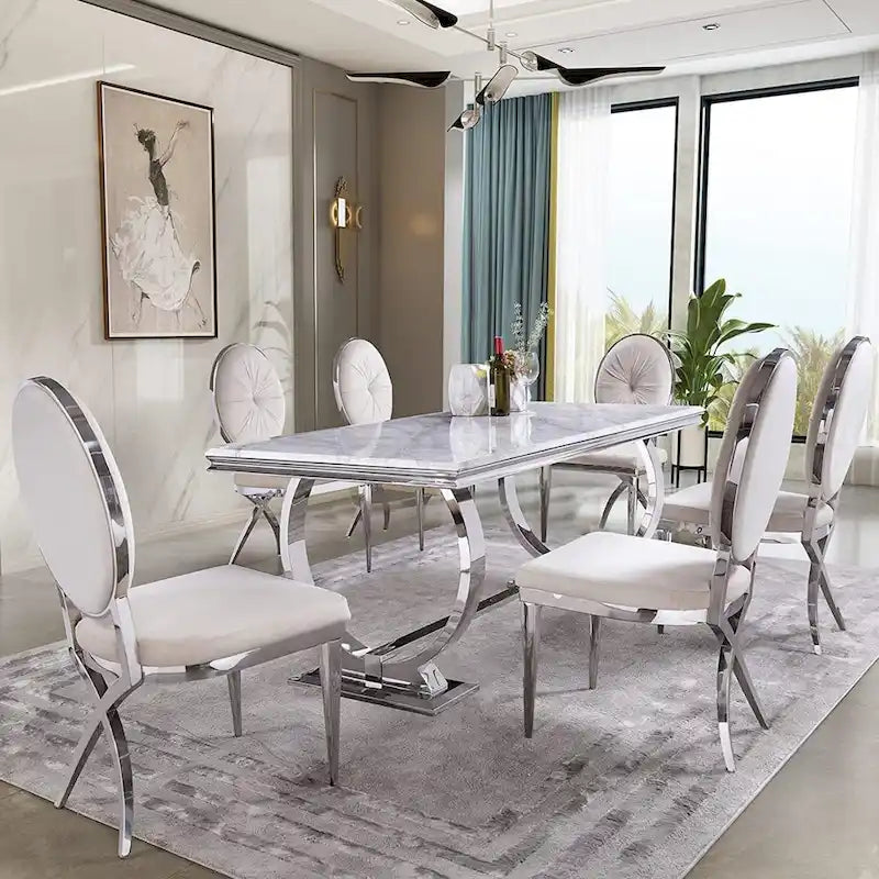 Table à manger plateau en faux marbre avec piètement en U en acier inoxydable poli